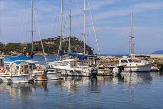 Sailboats anchoring in the harbour of Cavo