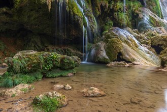 The Baume-les-Messieurs waterfall is a tourist destination in summer. Jura