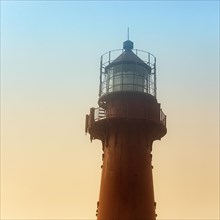 Red lighthouse in the haze