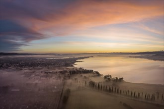 Aerial view of western Lake Constance in front of sunrise with ground fog in the Radolfzell Aachried