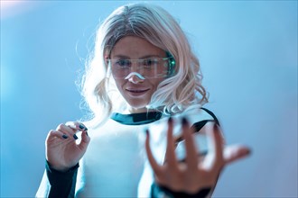 Woman with illuminated futuristic glasses and white hair