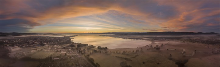 Aerial view of western Lake Constance in front of sunrise with ground fog in the Radolfzell Aachried