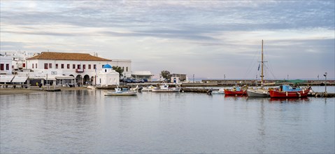Old port of Mykonos with colourful fishing boats and town hall