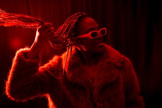 Young african woman with braids with red led lights