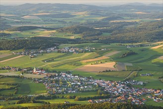 View from Hoher Bogen mountain of the village of Neukirchen beim Heiligen Blut and the surrounding landscape