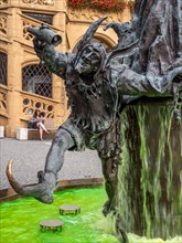 Detail with figure of the court jester The wedding fountain with green water on the Amberg market square