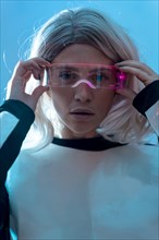 Portrait of woman looking with the futuristic glasses