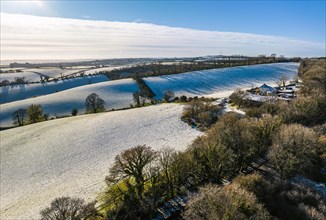 Fields and Farms shrouded in frost from a drone