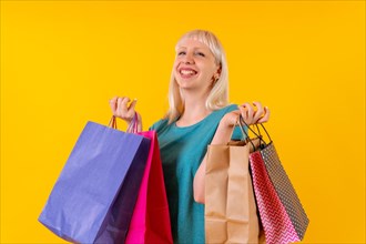 Smiling shopping with bags on sale