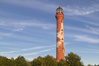 Weathered lighthouse in the evening light against a blue sky on Pakri Peninsula