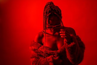 Attractive black ethnic woman with braids with red led lights