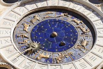 The astrological clock with moon phases and zodiac signs and dial made of Lapis Lazuli
