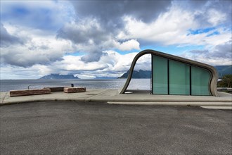 Ureddplassen rest area with wave-shaped concrete and glass toilet block