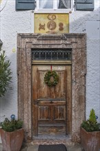 Historic entrance door of a former bakery on Fraueninsel