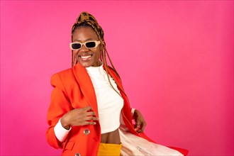 Black ethnic woman with braids on a pink background