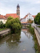 The river Vils and in the background the Basilica of St. Martin