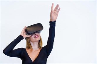 Woman with virtual reality glasses on white background