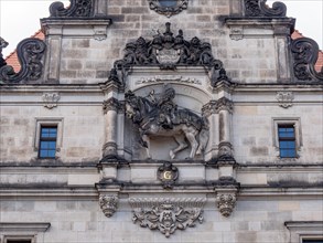 The upper part of the Georgentor building with the equestrian statue