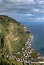 View of the cliffs with the sea and the town of Madalena do Mar