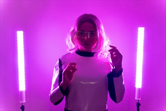 Woman with futuristic suit and glasses with pink led lights