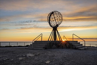 Steel globe at the North Cape under the midnight sun