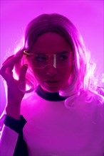 A woman in futuristic suit and glasses with pink lights