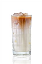 Iced coffee with milk in tall facetted glass with reflection