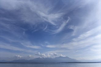 Cloudy sky with Lake Chiemsee and the Chiemgau mountains