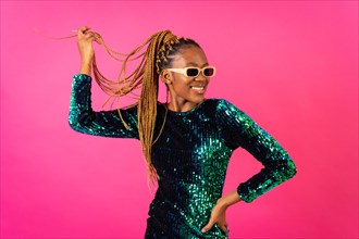 A black ethnic woman with party braids on a pink background