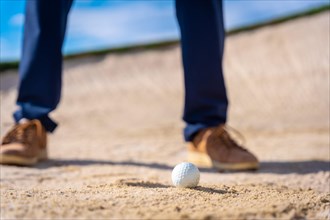 Feet of a man playing golf