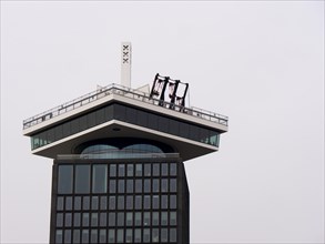 The top of the modern building ADAM Tower with swings