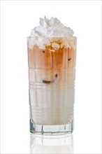 Iced coffee with milk and whipped cream in tall facetted glass with reflection