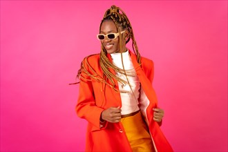 Black ethnic woman with braids on a pink background