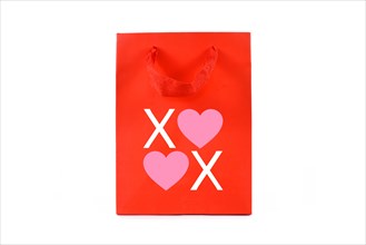 Red paper shopping bag with XOXO text with heart on white background
