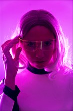 A woman in a futuristic suit and glasses with pink lights