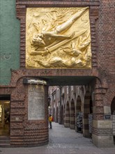 Entrance to Boettcherstrasse with gilded bronze relief by Bernhard Hoetger