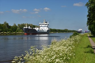 Ships sail in summer in the Kiel Canal