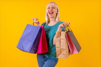 Laughing shopping with bags on sale