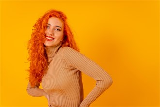 Red-haired woman on a yellow background