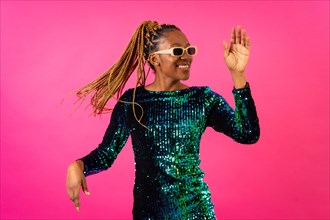 Black ethnic woman with braids party dancing on pink background