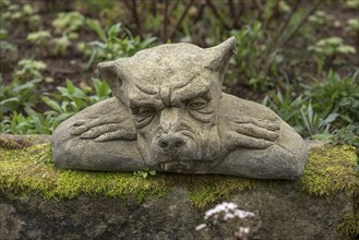 Sculpture of a grotesque in a garden