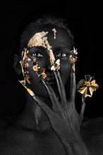 Beautiful woman with black art make-up