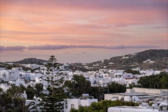 View over white Cycladic houses at sunrise