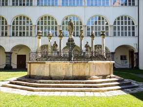 Artful fountain in front of the collegiate church