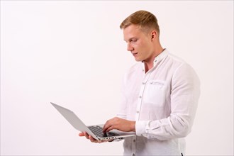 Caucasian businessman man with a laptop working on a white background