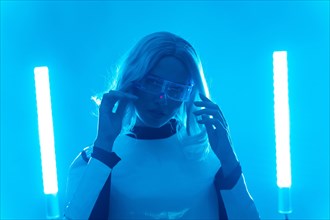A woman in a futuristic suit and glasses with blue lights
