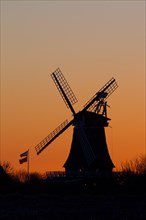 Traditional windmill at sunset