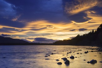 Loch Morlich and Cairngorm Mountains at sunset