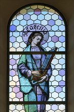Coloured stained glass window with St. Caecilia in the Church of Our Lady Mariae Namen