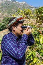 Traditional dressed man of the Qahtani Flower men tribe in the coffee plants